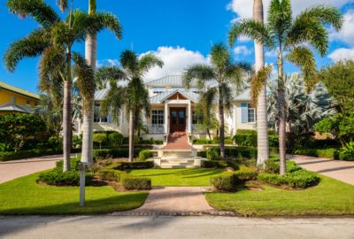 alt text = "single-story contemporary tropical home manicured to perfection to sell"