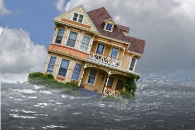 alt text = "home surrounded by water bobbing in the waves of foreclosure"