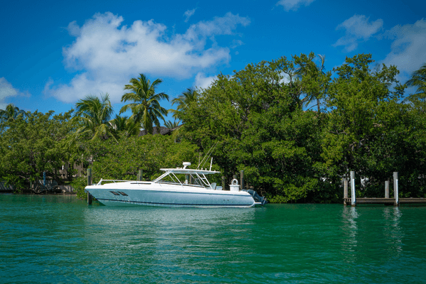 alt="Boat docked at a nature preserve in Boynton Beach Florida."