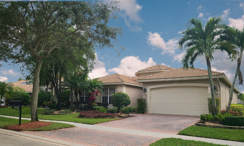 alt= "Single story home in Valencia Shores, a Lake Worth 55 plus community."